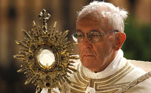 Pope Francis carries monstrance during observance of Corpus Christi feast