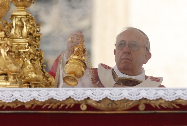 Pope Francis uses incense as he begins Palm Sunday Mass at Vatican