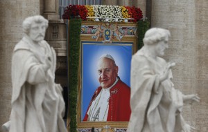 Banner depicting St. John XXIII hangs at Vatican