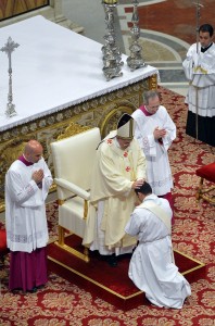 Pope Francis lays his hands on newly ordained priest during Mass in St. Peter's Basilica at Vatican