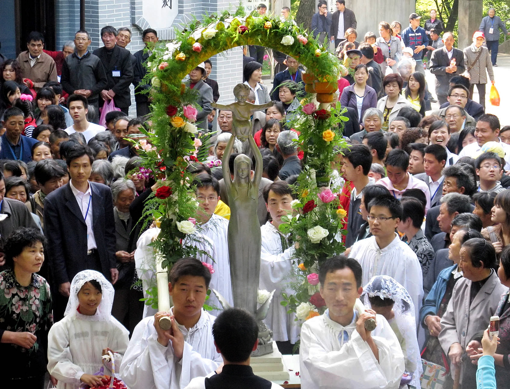CATHOLICS CARRY STATUE OF MARY AS THEY PROCESS TO SHESHAN MARIAN SHRINE IN CHINA