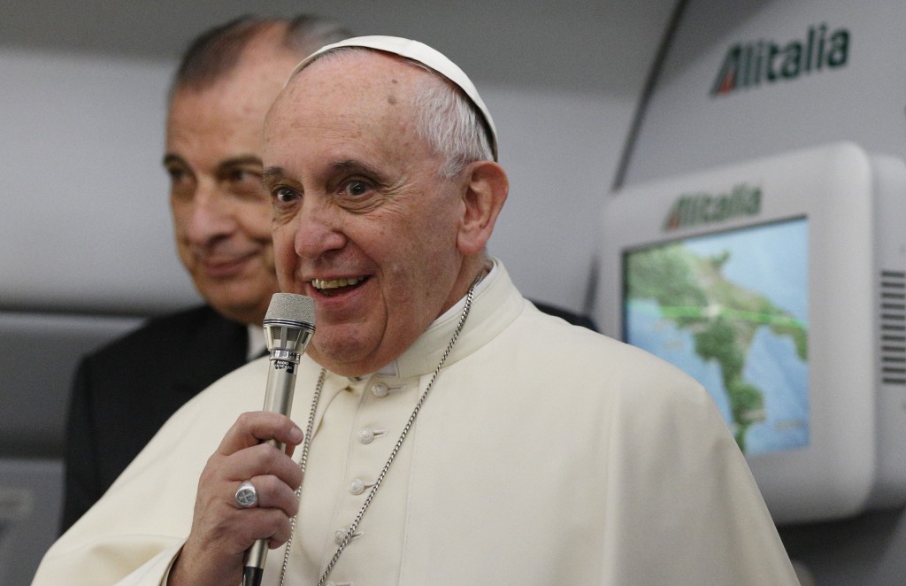 Pope Francis greets media aboard flight to Colombo, Sri Lanka