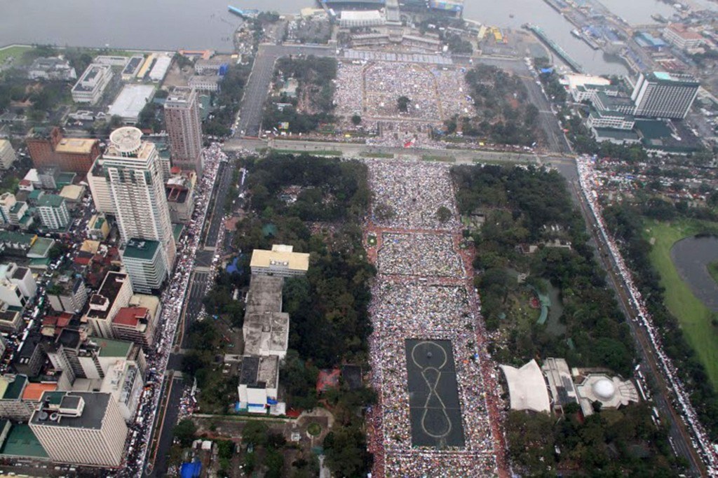 Handout photo shows aerial view of pilgrims gathering to hear Mass celebtated by Pope Francis at Rizal Park in Manila, Philippines