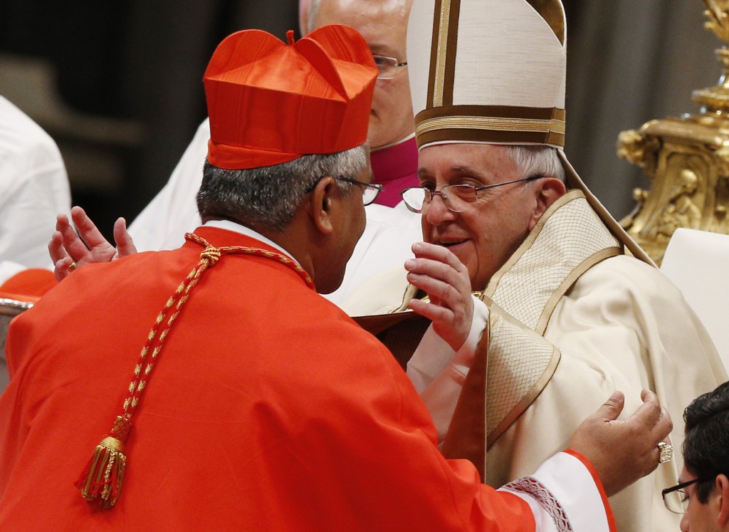 Pope Francis greets new Cardinal Mafi during consistory at which pope created 20 new cardinals in St. Peter's Basilica at Vatican