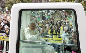 Pope Benedict XVI arrives in the popemobile at Avenida dos Aliados square to celebrate an outdoor Mass in Porto, northern Portugal. CNS Photo