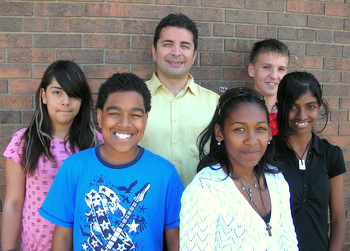 Principal Mark Cassar with students of Holy Cross Catholic School