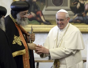 Pope Francis shakes hand of Coptic Orthodox leader during private audience at Vatican