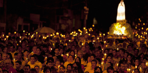 PILGRIMS PARTICIPATE IN CANDLELIGHT PROCESSION NEAR OUR LADY OF FATIMA SHRINE IN BRAZIL