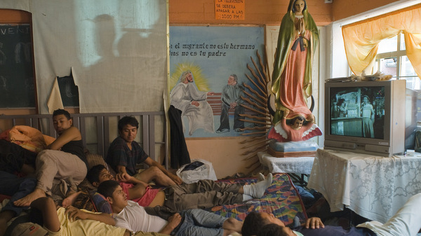 PEOPLE PACK ROOM AT CHURCH-RUN MIGRANT SHELTER OUTSIDE MEXICO CITY
