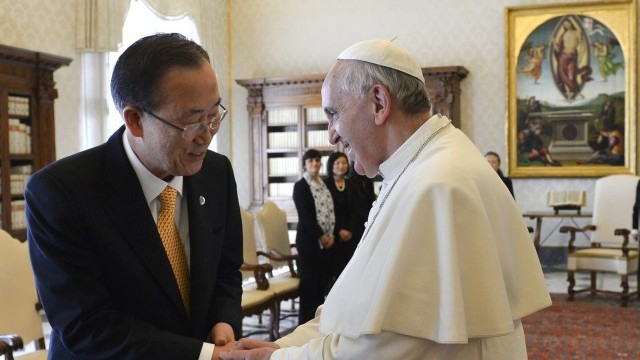 Pope Francis greets U.N. Secretary-General Ban Ki-moon during meeting at Vatican