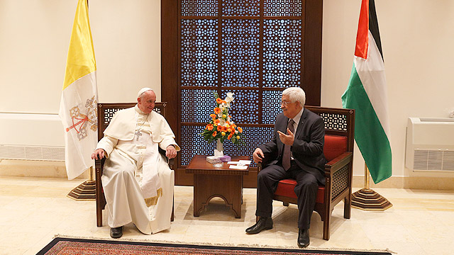 Pope Francis visits with Palestinian President Mahmoud Abbas after an arrival ceremony at the presidential palace in Bethlehem, West Bank, May 25. (CNS photo/Paul Haring) 