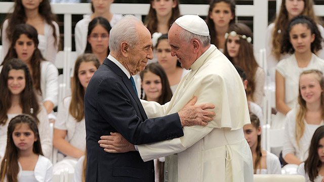Pope Francis greets Israeli President Shimon Peres in Jerusalem May 26. The pope told Peres that he wanted to "invent a new beatitude, which I apply to myself, 'Blessed is the one welcomed into the home of a wise and good man.'" (CNS photo/ Tsafrir Abayov, EPA) 