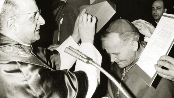Archbishop Karol Wojtyla receives the cardinal's red biretta from Pope Paul VI in 1967