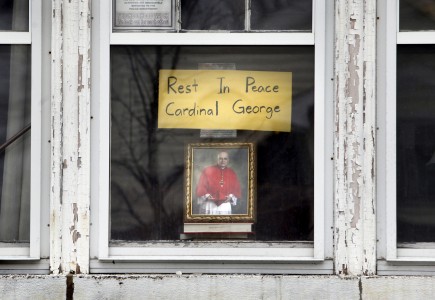 Tribute to Cardinal Francis E. George seen in window of Chicago home