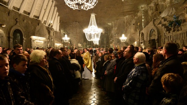 In this Dec. 24, 2013 file photo, Polish miners and their families gather for Christmas Eve Mass at the Wieliczka Salt Mine. (CNS photo/Jacek Bednarczyk, EPA) See WYD-FRANCIS May 28, 2015.