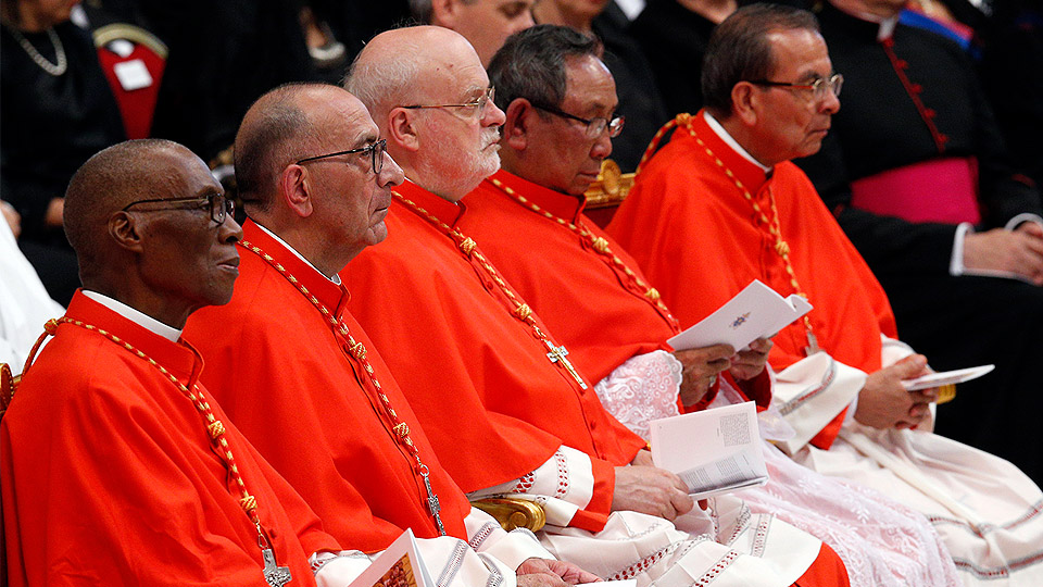 New Cardinals look on as Pope Francis leads a consistory in St. Peter's Basilica at the Vatican June 28. Pictured are Cardinals Jean Zerbo of Bamako, Mali; Juan Jose Omella of Barcelona, Spain; Anders Arborelius of Stockholm; Louis-Marie Ling Mangkhanekhoun of Pakse, Laos; and Gregorio Rosa Chavez of San Salvador, El Salvador.