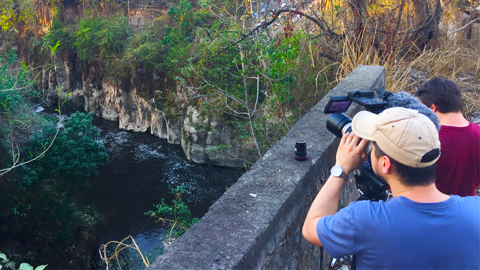 The crew of The Francis Impact film a river in El Salvador
