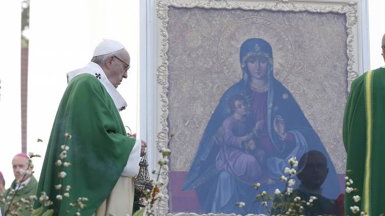 Pope Francis uses incense as he reverences a Marian image during Mass at Santakos Park in Kaunas, Lithuania