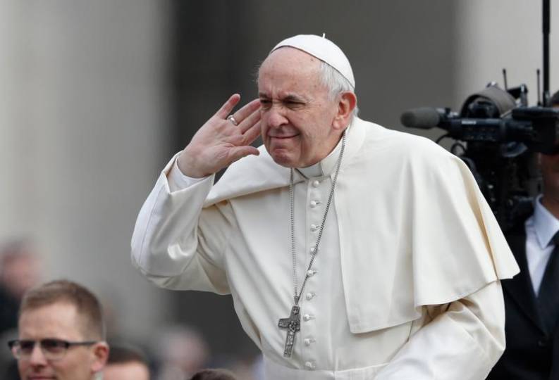Pope Francis gestures as he greets the crowd during his general audience in St. Peter's Square at the Vatican March 28. (CNS photo/Paul Haring)