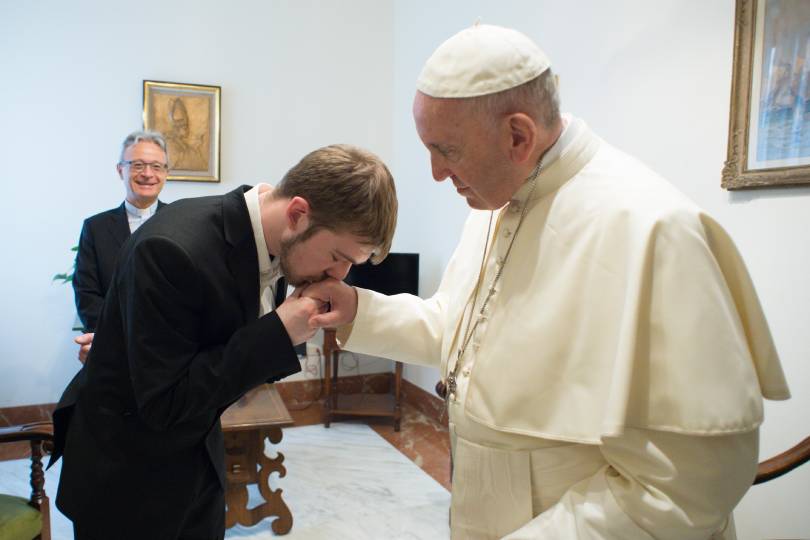 Tom Evans, father of the seriously ill child Alfie Evans, kisses Pope Francis' hand during a private audience in the Domus Sanctae Marthae at the Vatican April 18. Evans pleaded for "asylum" for his son in Italy so he may receive care and not be euthanized in England. Italy granted asylum April 23. (CNS photo/Vatican Media)
