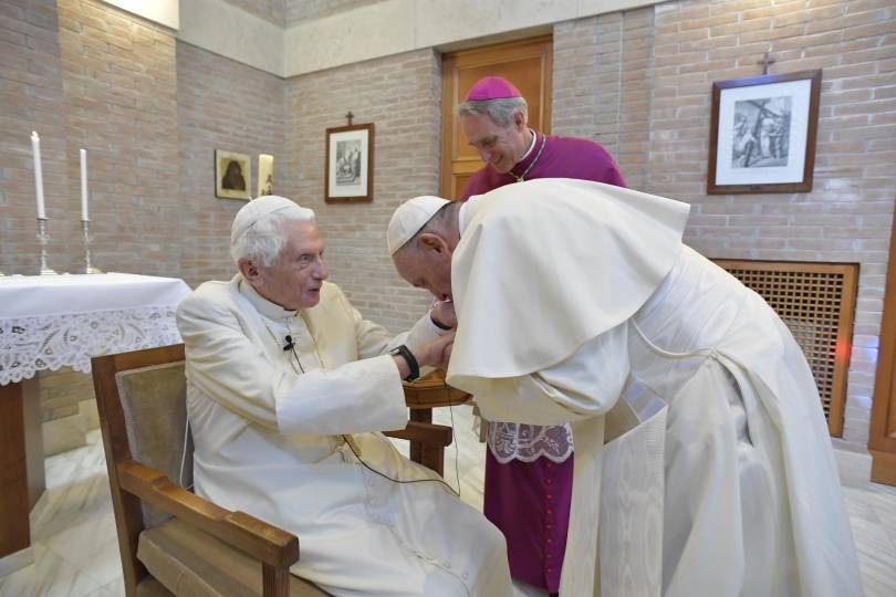 Retired Benedict XVI and Pope Francis exchange greetings at the Mater Ecclesiae Monastery after a consistory at which Pope Francis created 14 new cardinals at the Vatican June 28. The new cardinals came to greet Pope Benedict. (CNS photo/Vatican Media)