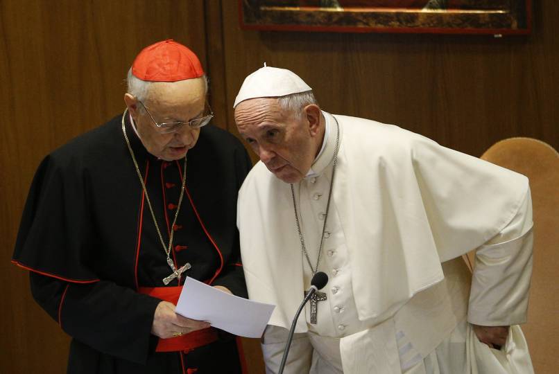 Pope Francis talks with Cardinal Lorenzo Baldisseri, secretary-general of the Synod of Bishops, before a session of the Synod of Bishops on young people, the faith and vocational discernment at the Vatican Oct. 11. (CNS photo/Paul Haring)