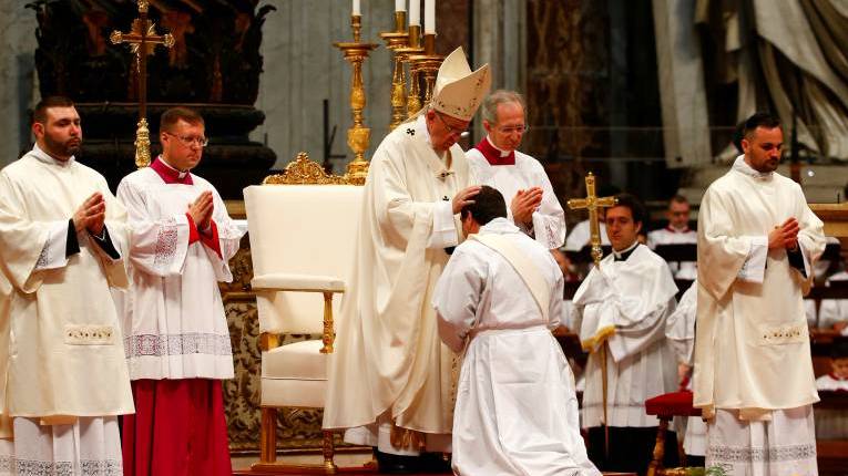 Pope Francis ordains one of 16 new priests during a Mass in St. Peter's Basilica at the Vatican on April 22, 2018. (CNS photo/Tony Gentile, Reuters)