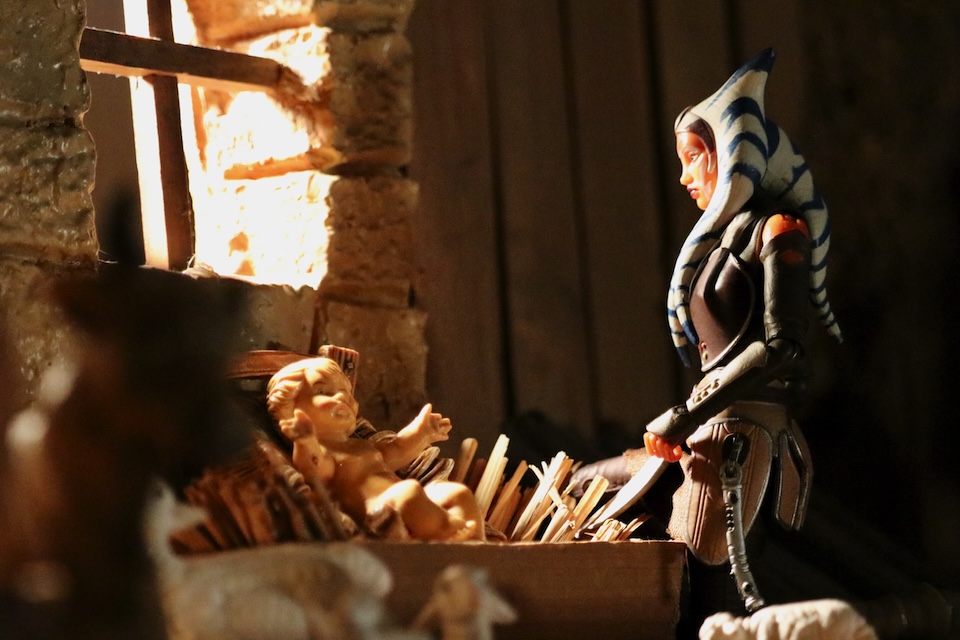 One more action figure watching over Jesus in a manger.