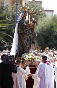 Pope prepares incense as he venerates statue during Mass at Sanctuary of Our Lady of Bonaria in Cagliari