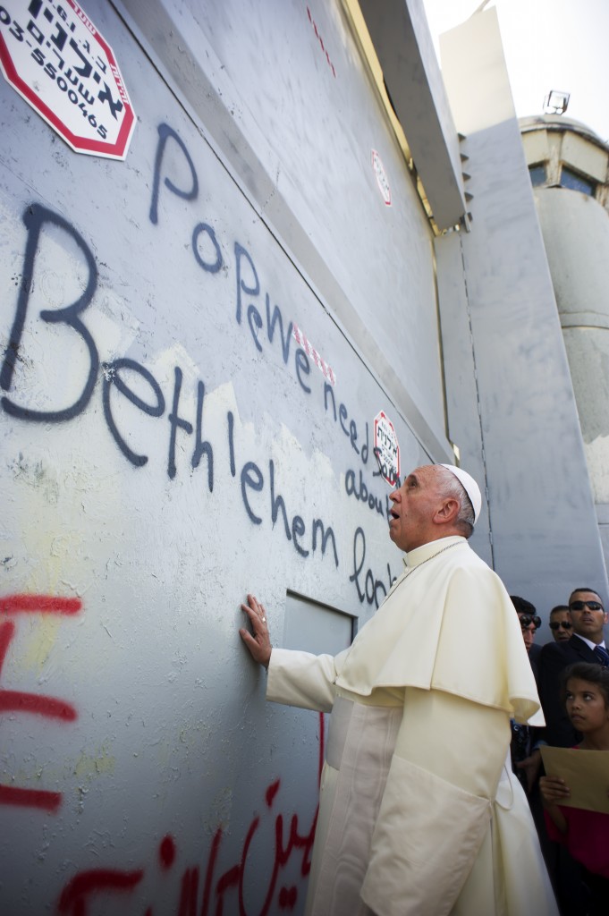 Pope Francis stops in front of the Israeli security wall in Bethlehem, West Bank
