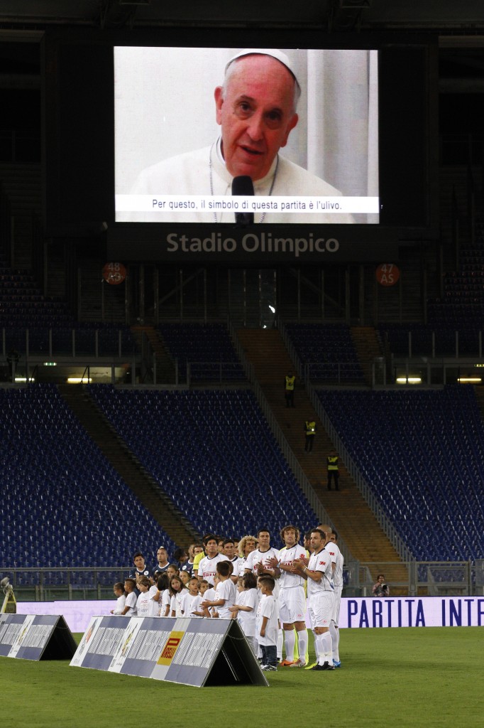 Pope Francis speaks via video link from Vatican before 'Interreligious Match for Peace' in Rome