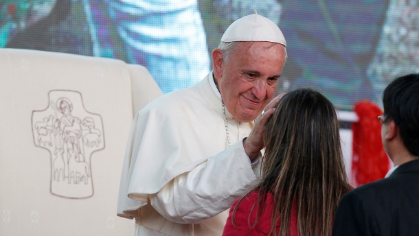Pope Francis greets young woman during meeting with young people along waterfront in Asuncion, Paraguay
